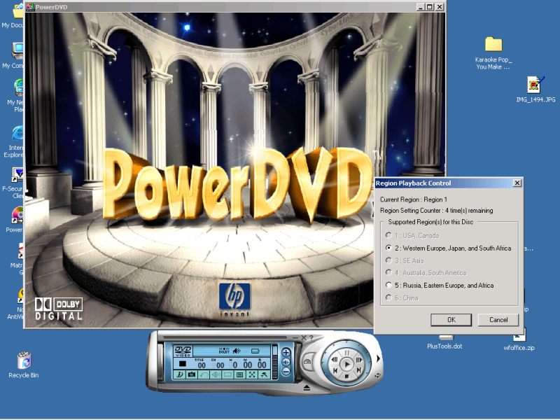 Screenshot of a PowerDVD window on the Windows 2000 platform along with the "Region Playback Control" dialog box that
appears after insertion into the DVD drive of a DVD disk that has a region code different from the one specified when the software was installed or last changed.